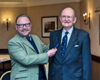 March 2022 Moderator David Cuthbert presenting a 50 years service Bar to C Roger P Ward. (Photo by kind permission of Richard Wilkins)